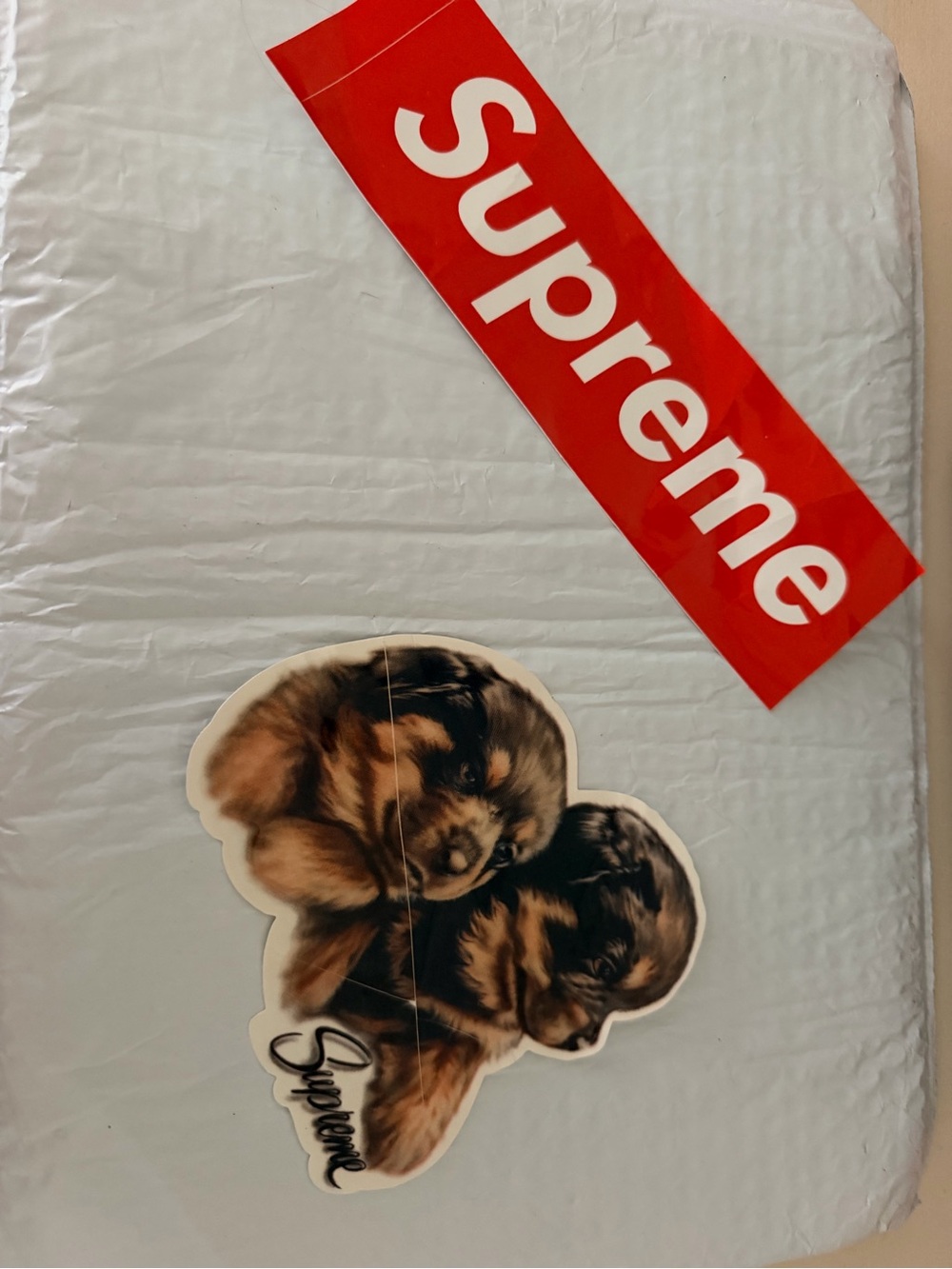 Supreme Red and White Box Logo Sticker with Puppy Graphic